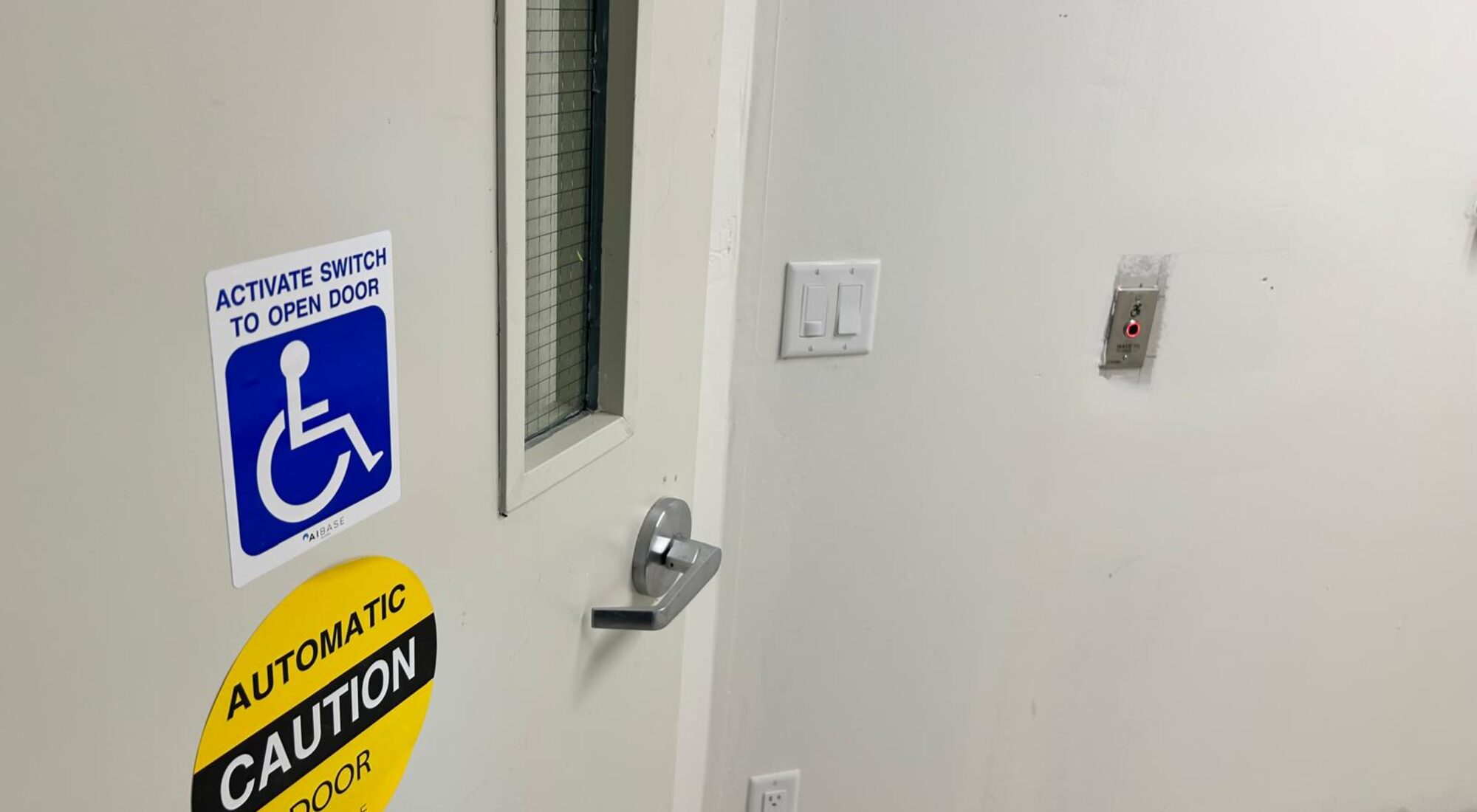 Accessible door actuator and signage reading activate switch to open door