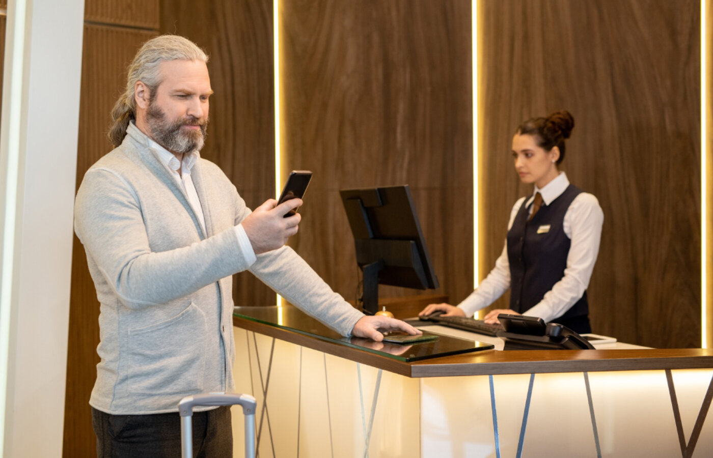 Hotel front desk team working at the property management system