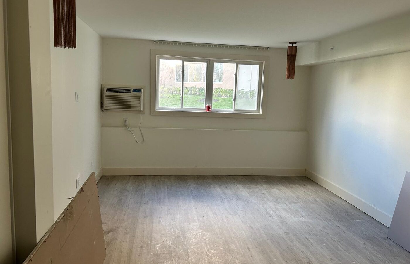 Guest room prepared for a wall mounted display before furniture arrives